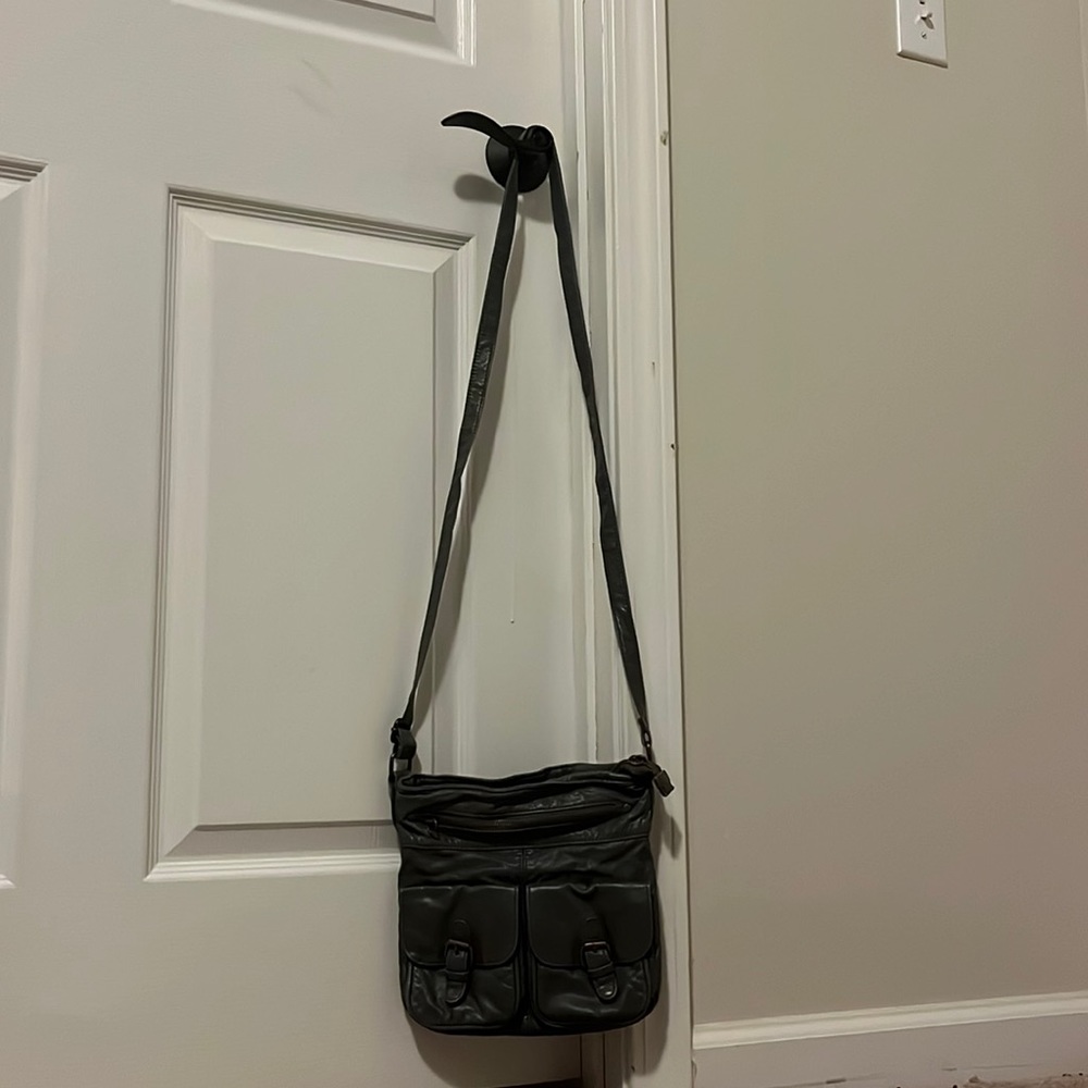 Slightly used. Shoulder purse. Gray. No tears.